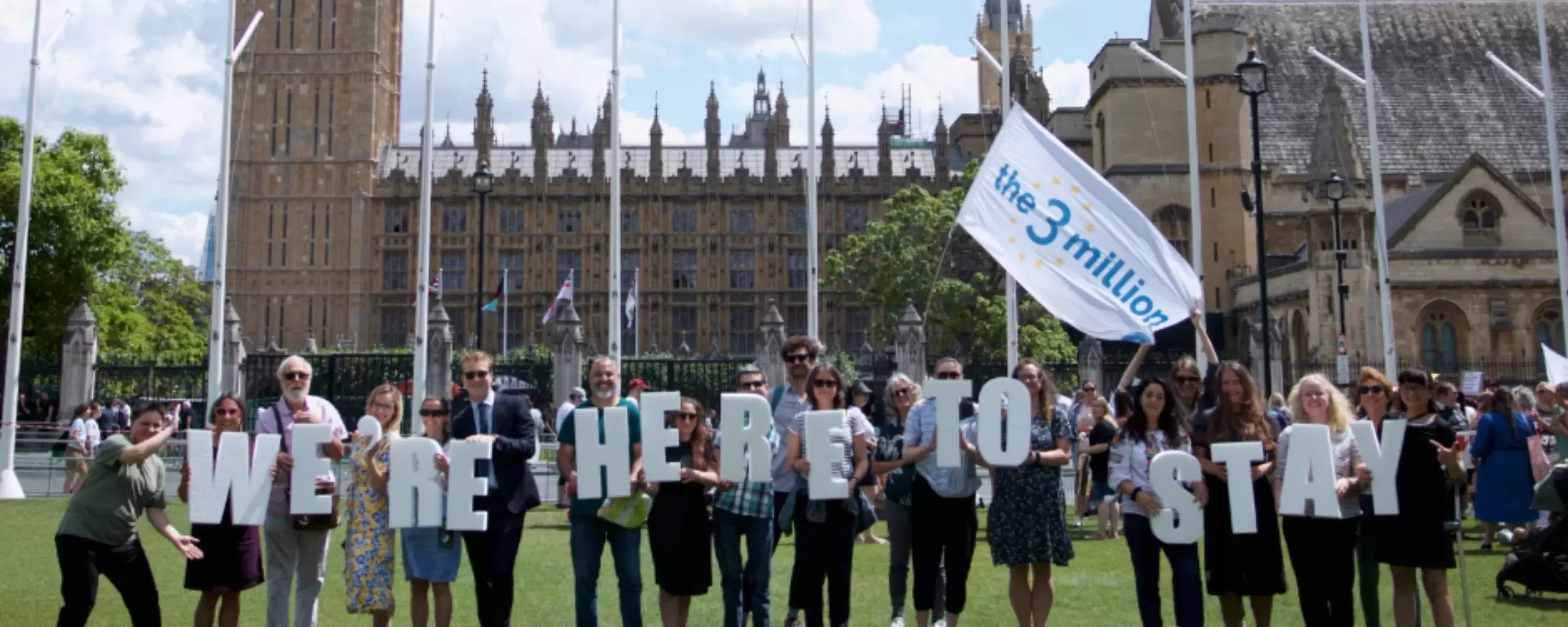 Demonstration in Parliament Square with protesters from the three million holding placards which spell out 'we're here to stay'